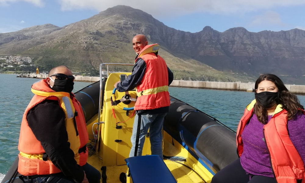 Friends enjoying a one-of-a-kind boat adventure in Cape Town