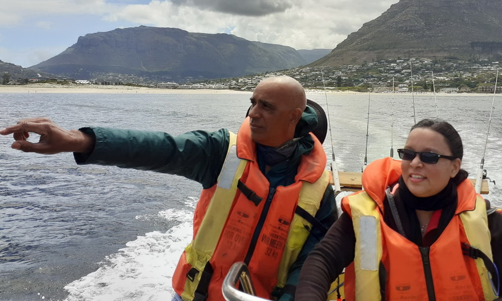 Sunset memorial boat trip for spreading ashes at sea near Cape Town